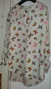 White shirt with multi coloured butterfly detail