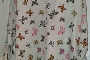 White shirt with multi coloured butterfly detail