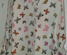 White shirt with multi coloured butterfly detail