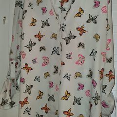 White shirt with multi coloured butterfly detail