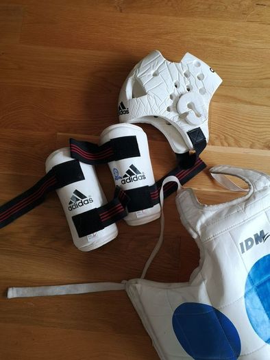 Taekwando protective gear - child. Arm guards, shin and foot guards, chest guard and head gear.