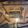 vintage shadow box containing a mix of antique tools, keys, and a loom. Image 3
