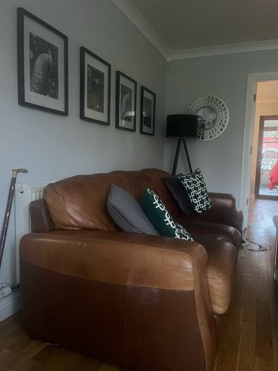 Three seater brown leather couch