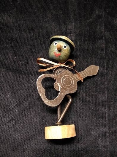 Guitar shaped bottle opener