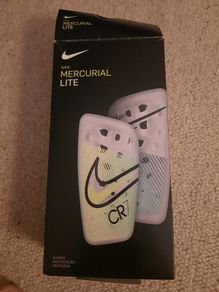 Nike, Mercurial Lite Size Medium shin guards with sleeve.