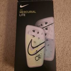 Nike, Mercurial Lite Size Medium shin guards with sleeve.