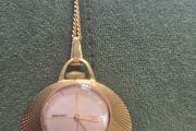 Gold necklace watch