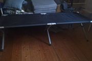 Camp bed/high off the floor. Strong army quality.