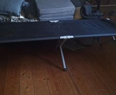 Camp bed/high off the floor. Strong army quality.