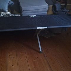 Camp bed/high off the floor. Strong army quality.
