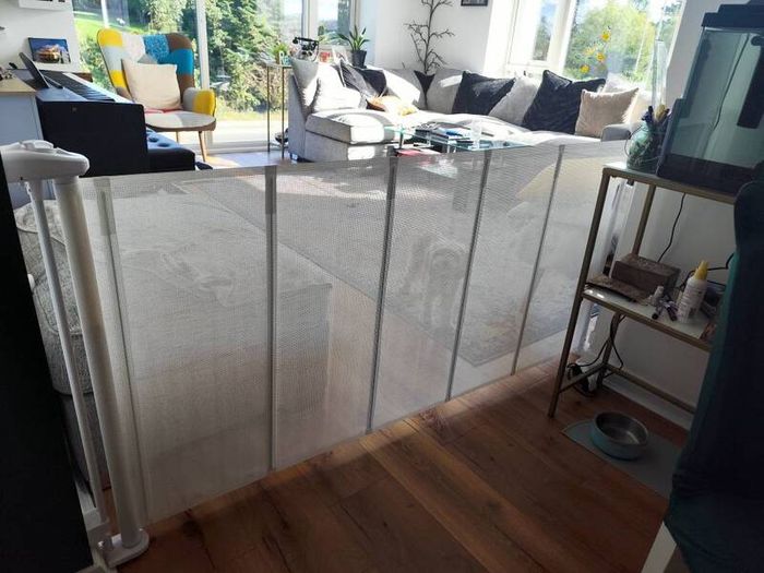 Retractable mesh safety gate