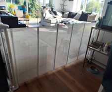 Retractable mesh safety gate