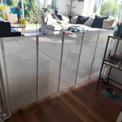 Retractable mesh safety gate