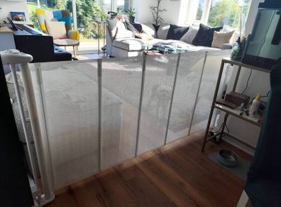 Retractable mesh safety gate