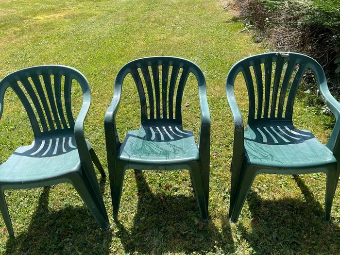 Green plastic garden chairs
