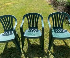 Green plastic garden chairs