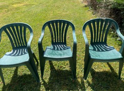 Green plastic garden chairs
