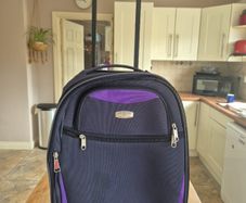 small navy suitcase
