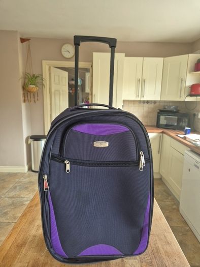 small navy suitcase