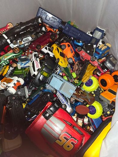 big bag of cars and a few wrestlers
