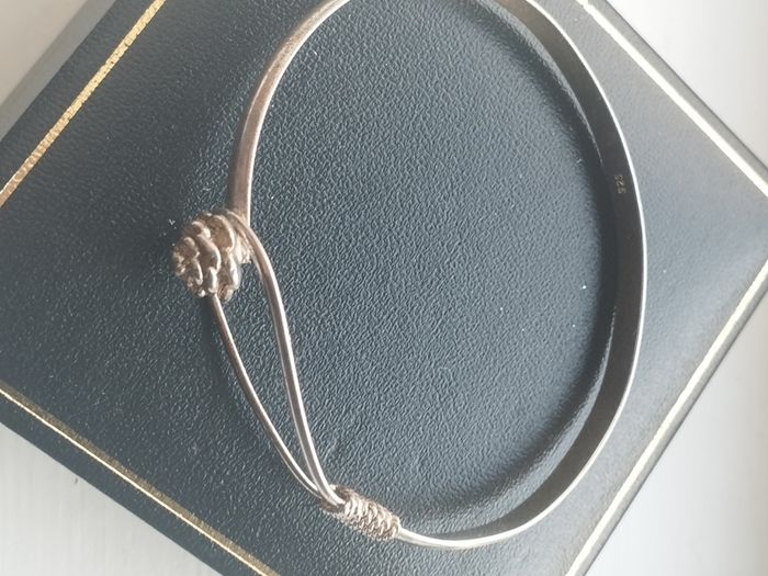 Vintage sterling silver bracelet with a rose-shaped clasp.