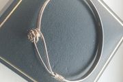 Vintage sterling silver bracelet with a rose-shaped clasp.