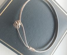 Vintage sterling silver bracelet with a rose-shaped clasp.