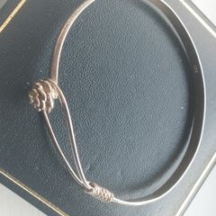 Vintage sterling silver bracelet with a rose-shaped clasp.