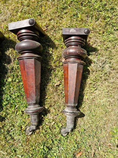 Antique mahogany piano legs with bronze casters