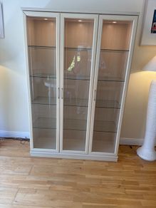 glass cabinet with built in spotlights