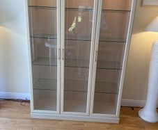 glass cabinet with built in spotlights