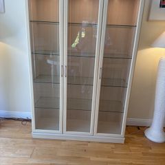 glass cabinet with built in spotlights