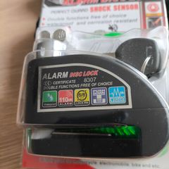 Motorcycle alarm disc lock