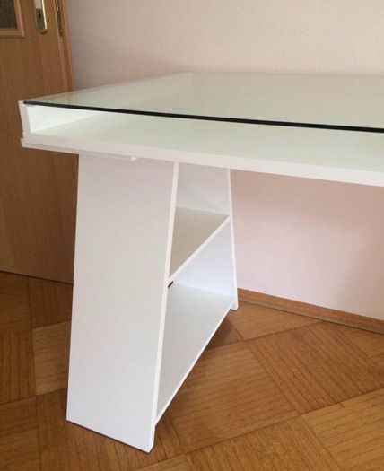 Study/ Office table Used but in great condition This is a modern minimalist table with a sleek white finish and a glass top