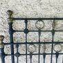 Antique iron bed with brass detail. Image 2