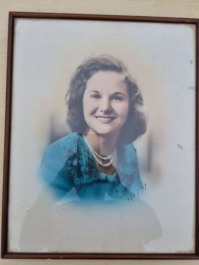 Archival, hand-colored portrait of a woman