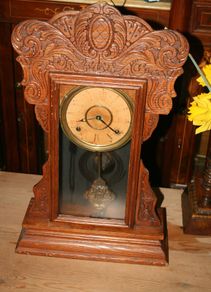 Antique Mantel Clock made by Waterbury AMERICAN GINGERBREAD CLOCK Carved Oak Case 59 x 35cm works well