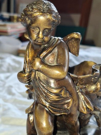 Bronzed Winged Cherub putto open seashell or leaf-shaped vessel with a scorpion like tail.