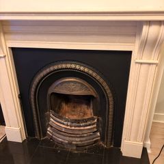 Fireplace stone with cast iron insert