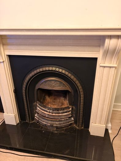 Fireplace stone with cast iron insert