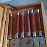 A Newbridge Cuisine set of six steak knives with serrated blades and wooden handles. Image 4