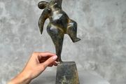 Solid bronze staue of a voluptuous balancing lady