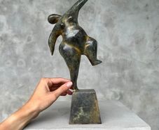 Solid bronze staue of a voluptuous balancing lady