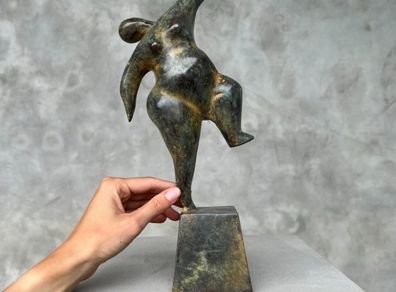 Solid bronze staue of a voluptuous balancing lady
