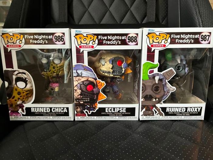 Five Nights at Freddys plushies and dragon figures