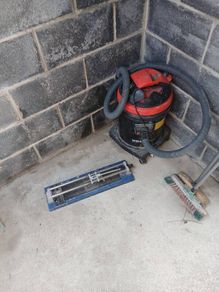 industrial hoover and tile cutter