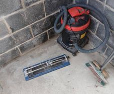 industrial hoover and tile cutter