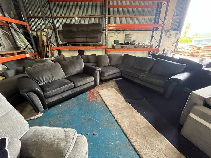 Black corner sofa with matching 2 seater