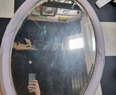 Oval mirror with fluted frame for collection