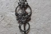 St Justin pewter broach.